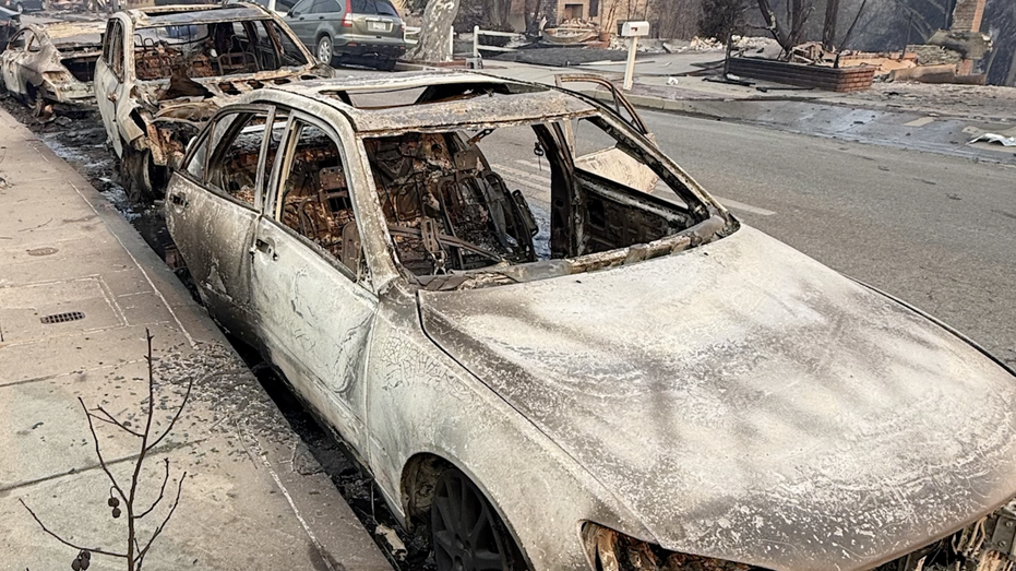 Burnt vehicles on road