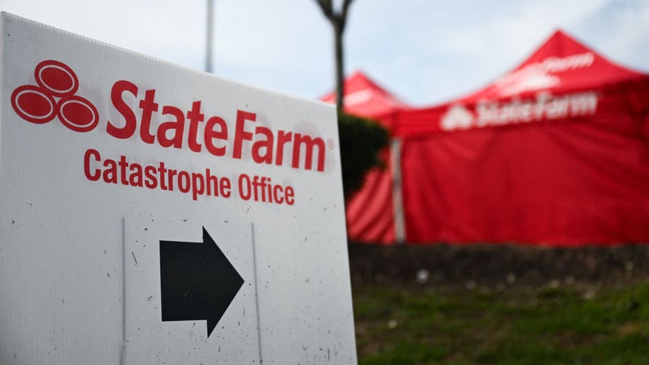 State Farm Insurance catastrophe office sign pointing to tents