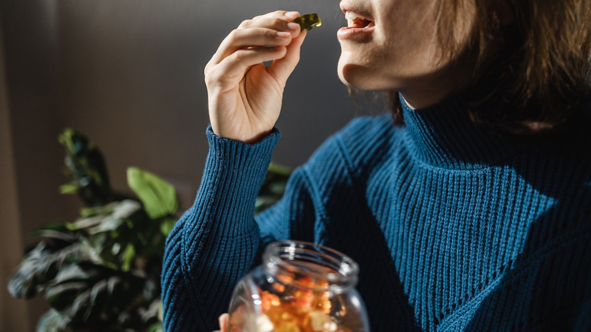 Woman taking gummies