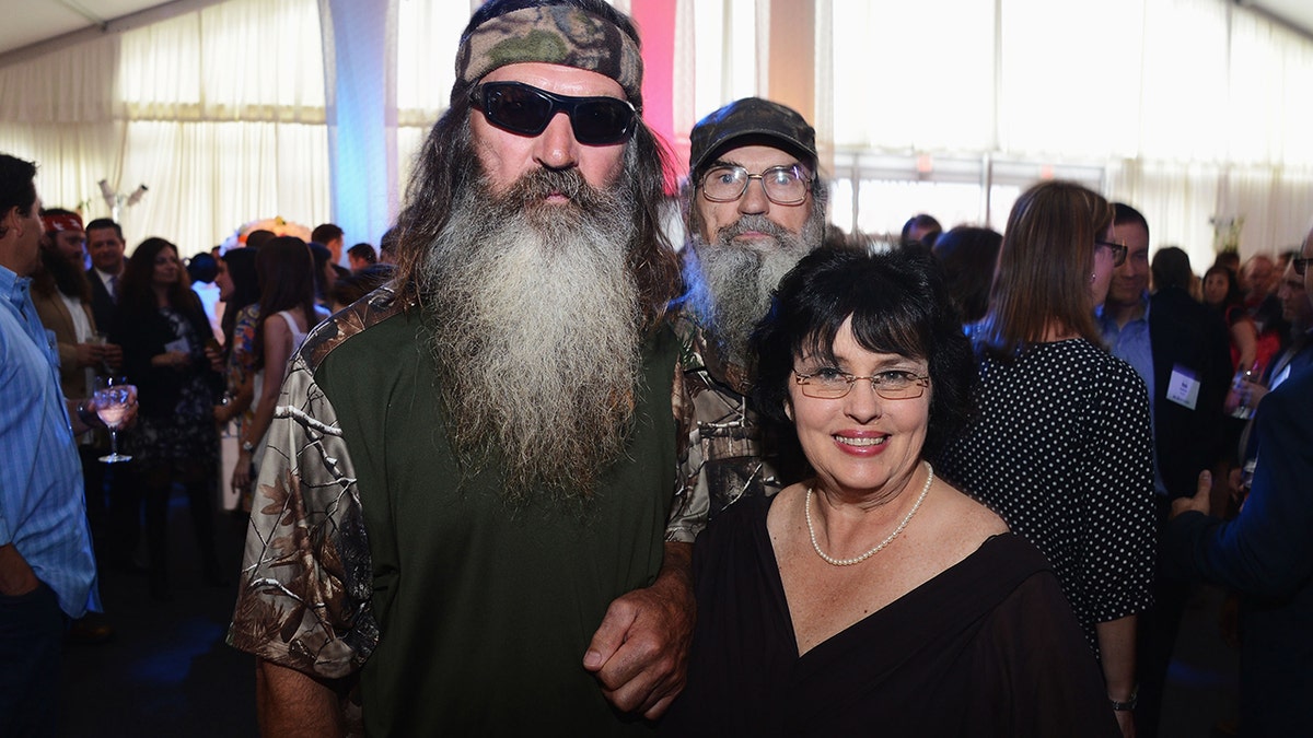 Phil Robertson posing with Kay Robertson