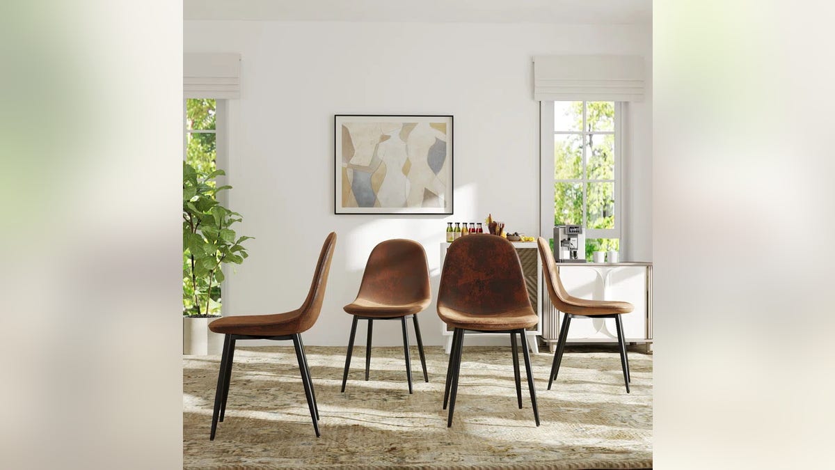 The Minehead Upholstered Side Dining Chair comes in a set of four.